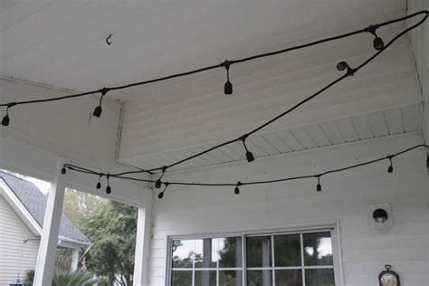 The Easiest Way To Hang String Lights On A Screened Porch