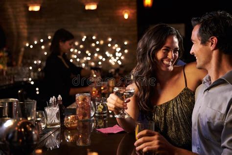 Couple Enjoying Night Out At Cocktail Bar Stock Image Image Of Drinking Indoor 67525917