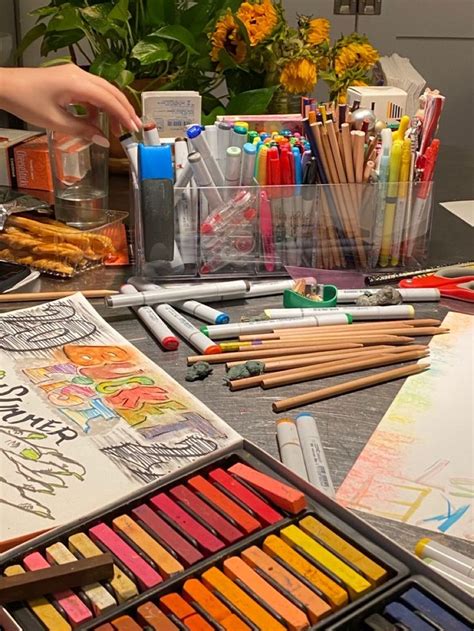 A Table With Many Different Colored Crayons And Pencils