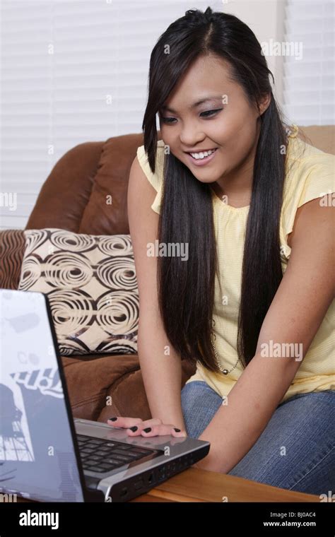 Teen Girl Using A Laptop Computer Stock Photo Alamy