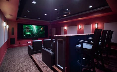 A basement renovation complete with a custom home theater, gym, seating area, full bar, and showcase wine cellar. 15 Interesting Media Rooms and Theaters With Bars | Home ...