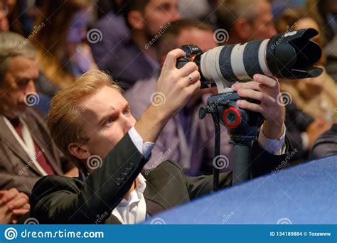 Professional Photographer Working At Business Conference Editorial