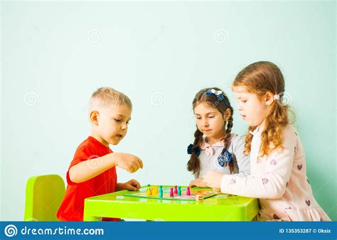 Three Kids Playing Ludo Game At Home Stock Image Image Of Green Game