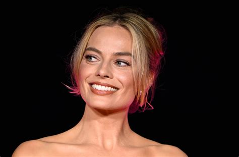 Margot Robbie Swaps Her Pastel Pink Outfits For The Littlest Red Corset Dress Glamour