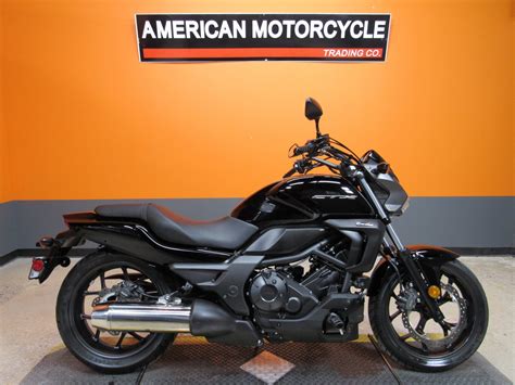 Horsepower and torque, cylinder compression, valve clearance, oil type and capacity, service data and torque specs. 2014 Honda CTX700N | American Motorcycle Trading Company ...