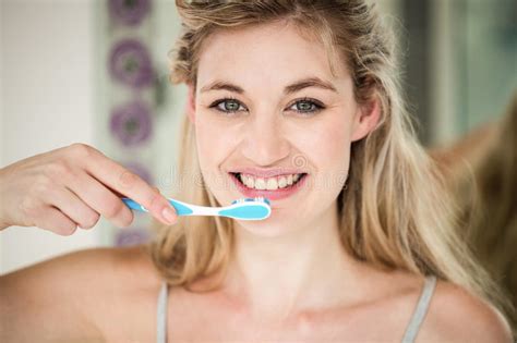 Portrait Of Smiling Woman Brushing Teeth Stock Image Image Of Casual Bathroom