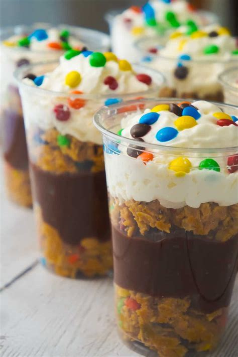 Instant chocolate pudding, monster cookies, whipped cream, m&ms or smarties. Monster Cookie Pudding Parfaits - This is Not Diet Food
