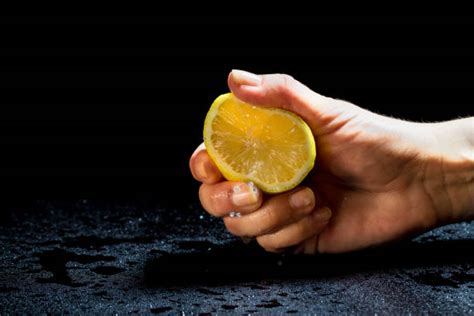 Best Hand Squeezing A Lemon Stock Photos Pictures And Royalty Free