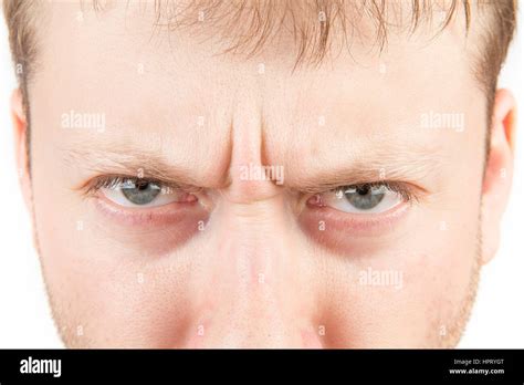 Mans Angry Eyes Close Up On White Stock Photo Alamy