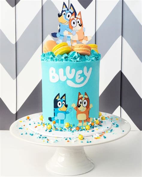 A Blue Cake With Cartoon Characters On It And Confetti Sprinkles