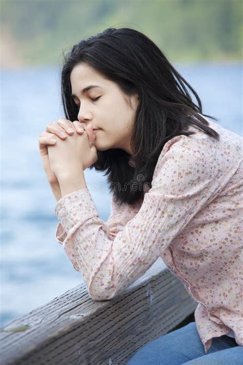 Young Teen Girl Praying Quietly On Lake Pier Stock Image Image Of