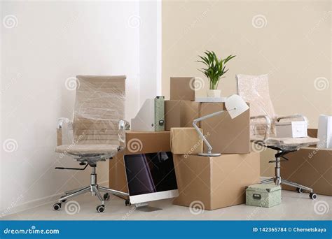 Moving Boxes And Furniture Stock Photo Image Of Cardboard 142365784
