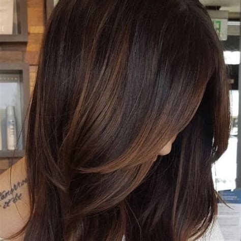 The glowing look it imparts, apart from adding volume, makes. 50 Intense Dark Hair with Caramel Highlights Ideas | All ...