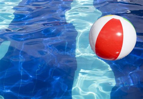 Beach Ball Floating In Swimming Pool Stock Photo Image Of Balloon