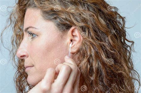 Woman Cleaning Her Ear With A Cotton Swab Stock Image Image Of Soft