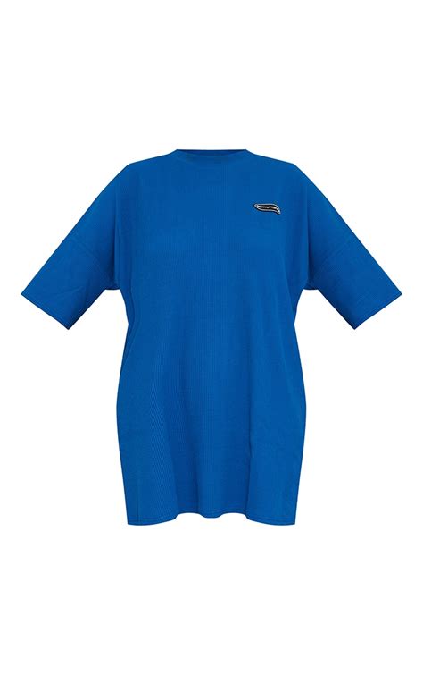 Prettylittlething Blue Badge Rib Oversized T Shirt Dress