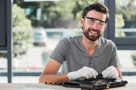 Premium Photo Portrait Of A Happy Young Male Technician Repairing