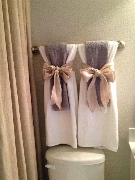 Arrange the bath towels with matching hand towels and washcloths in a pattern that shows off the color contrasts for a quick and easy display. Towel Arrangements | Bathroom towel decor, Bathroom towels ...