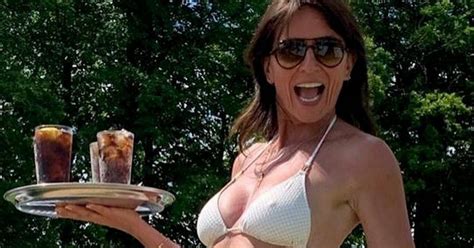 Davina Mccall Shows Off Her Washboard Abs As She Playfully Poses In