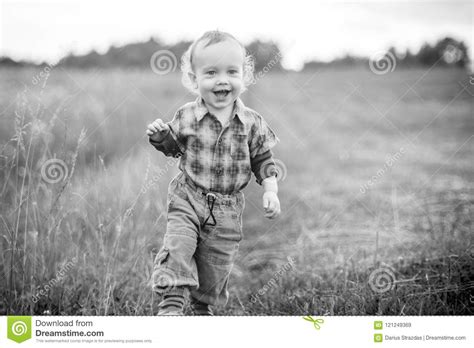Child Boy Walking In A Meadow Stock Image Image Of Playtime Person