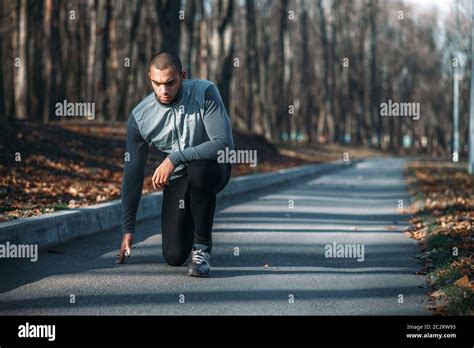 Male Athlete Prepares To Run Training Outdoor Jogger On Morning Workout Athletic Man Running