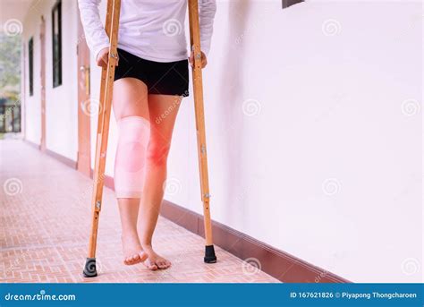 Woman Using Crutch And Broken Leg For Walking At Homeclose Up Stock