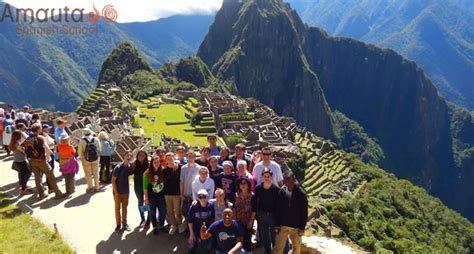Group Of Tourists Visiting Machu Picchu