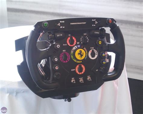 In a layout common to racing cars, the new steering wheel incorporates many controls normally located on the dashboard or on stalks, such as turning signals or high beams. Thrustmaster announces Ferrari F1 replica racing wheel | bit-tech.net