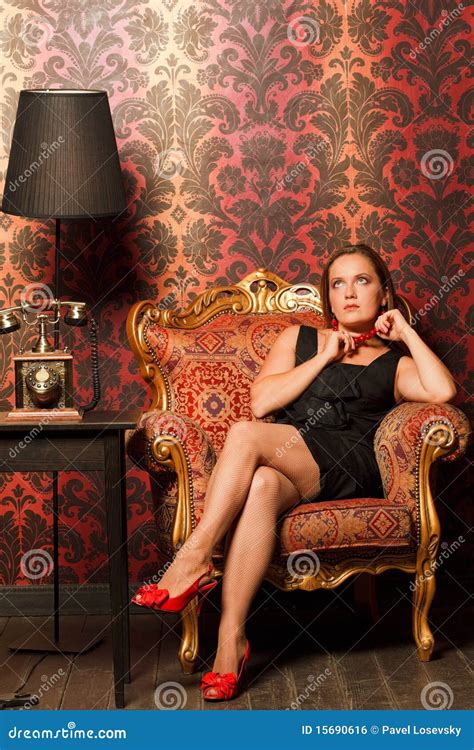 Woman In Black Dress Sitting On Vintage Chair Royalty Free Stock Image Image
