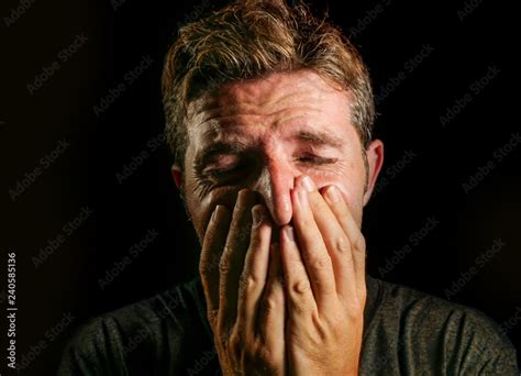 Fotka „young Sad And Devastated Man Crying Desperate Covering Face With His Hands Feeling