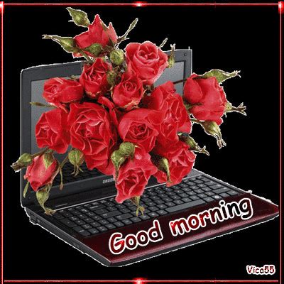 A Bouquet Of Red Roses Sitting On Top Of A Laptop Computer With The