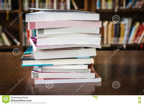 Pile Of Books In A Library And Bookshelf Stock Photo Image Of