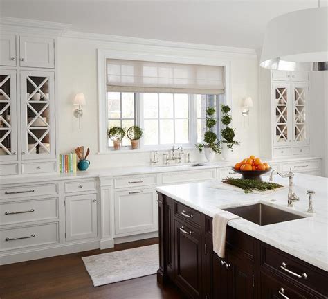 I would suggest you go to the browse rooms tab, select kitchens and click photos. White Kitchen Cabinets with Espresso Island - Transitional ...