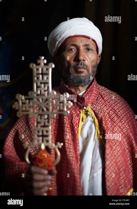 An Ethiopian Christian Orthodox Priest Holds Up A Lalibela Cross Stock