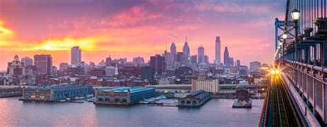 Philadelphia panorama under a hazy purple sunset. - Metro Philly HFMA