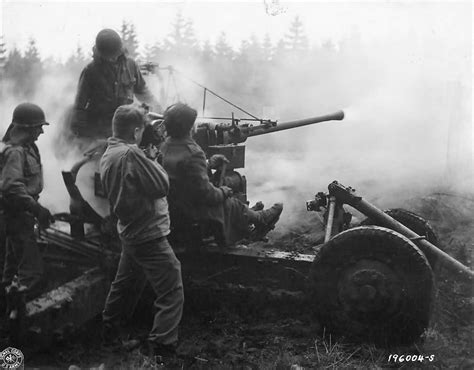 Soldiers Of The 461st Anti Aircraft Battalion Fire A 40mm Bofors Gun At