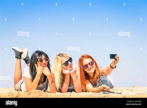 Group Of Girlfriends Taking A Selfie At The Beach Concept Of Friendship And Fun In The Summer