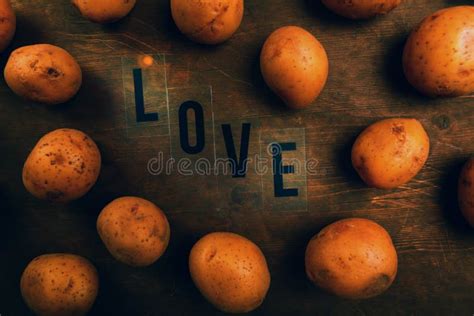 Potato Love Heart Shaped Potato In Front Of A Blackboard Stock Photo