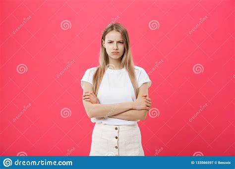 Shot Of Bored Annoyed Beautiful Teenage Girl With Straight Blond Hair Looking At Camera With