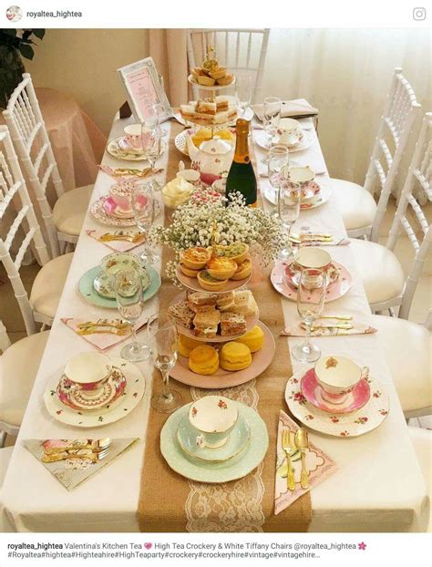 A Table With Plates Cups And Saucers On It Is Set For A Tea Party