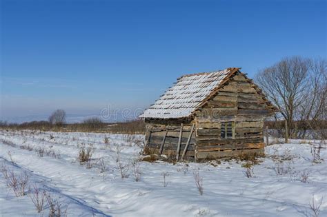 Landscape Of Old Abandoned Farm House Covered With Snow In