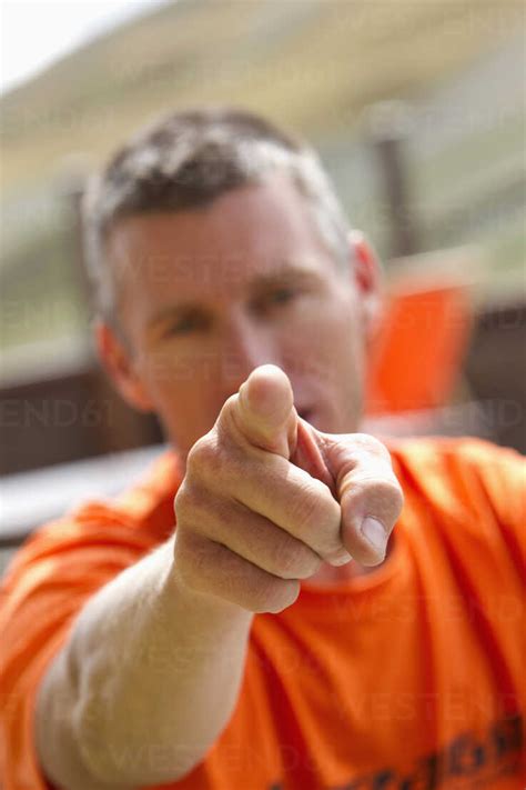 Close Up Of Man Pointing Finger Towards Camera Stock Photo