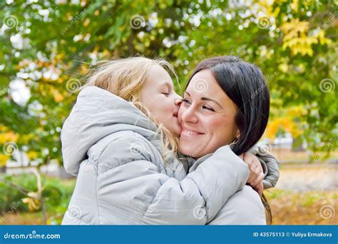 Mother And Daughter Kiss In Autumn Stock Image Image Of Seven Woman