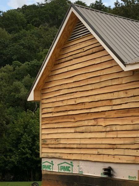 The Side Of A Wooden Building With A Metal Roof