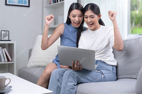 Premium Photo Happy Asian Lesbian Couple Using Laptop In The Living