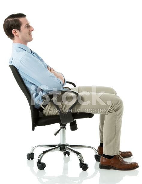 Side View Of Smiling Businessman Sitting On Chair Stock Photo Royalty