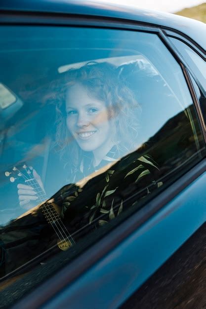 Free Photo Smiling Young Woman Sitting In Car