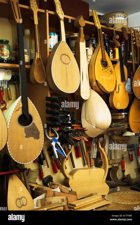 Variety Of Stringed Musical Instruments Display In Shop Stock Photo Alamy