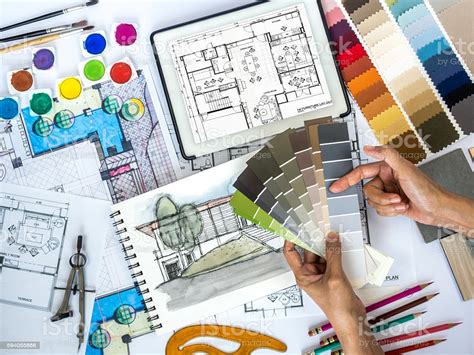 In a recent blog post, i talked about questions to ask yourself if you think you want to hire an interior in this column, i will be discussing the first stage of what interior designers do and what it's like to work with them. Architect Interior Designer Working At Worktable With ...