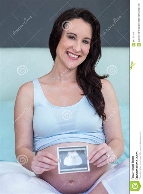 Pregnant Woman Showing Ultrasound Scan Stock Image Image Of Home